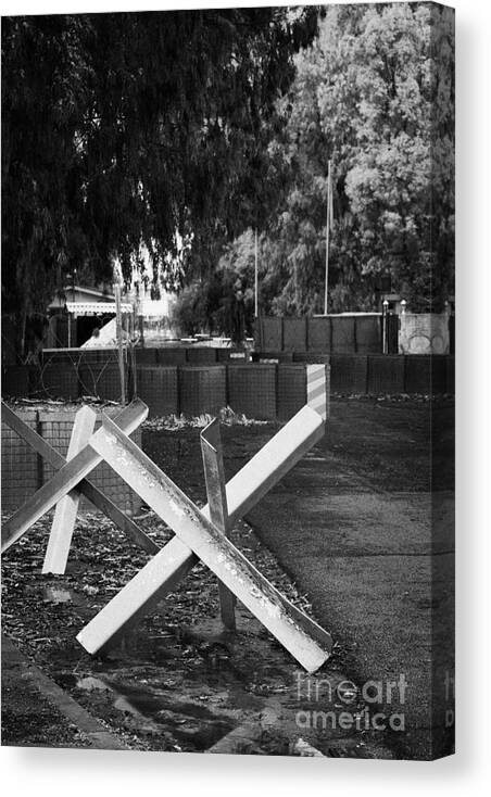 United Canvas Print featuring the photograph anti tank traps at entrance to UN buffer zone sector two wolseley barracks and ledra palace hotel #1 by Joe Fox
