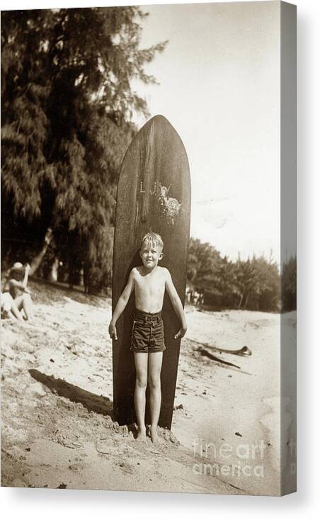 Little Boy Canvas Print featuring the photograph Little boy with Wooden Surfboard Circa 1960 by Monterey County Historical Society
