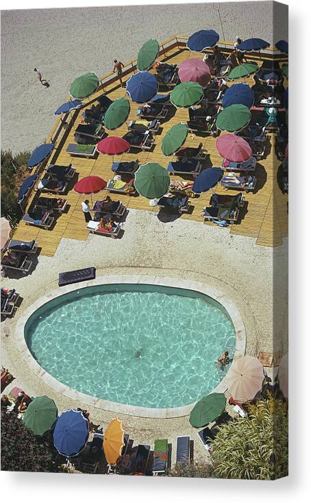People Canvas Print featuring the photograph Pool At Carvoeiro by Slim Aarons