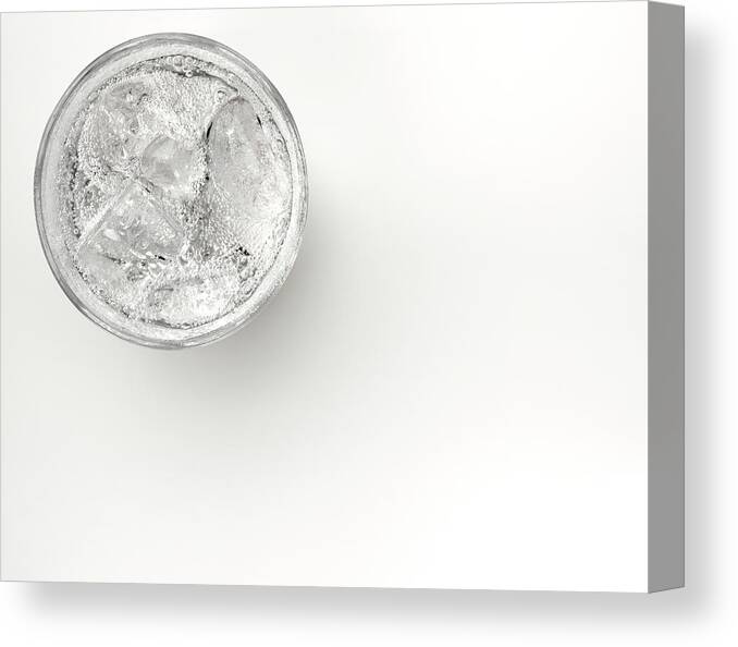 White Background Canvas Print featuring the photograph A Glass Of Sparkling Water With Ice by Anthony Bradshaw