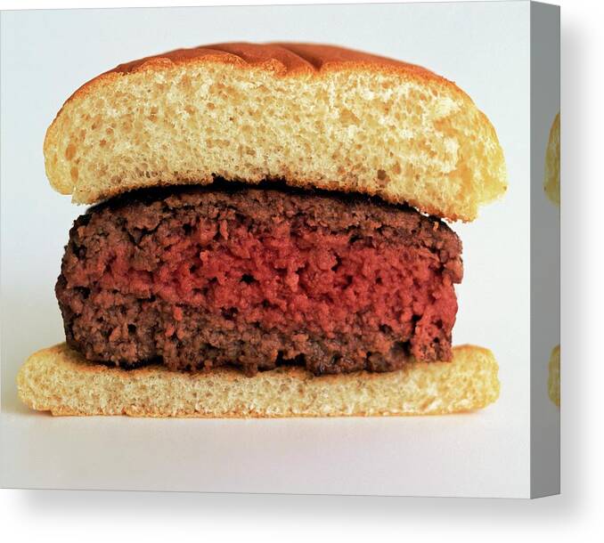 Cooking Canvas Print featuring the photograph A Rare Hamburger by Romulo Yanes