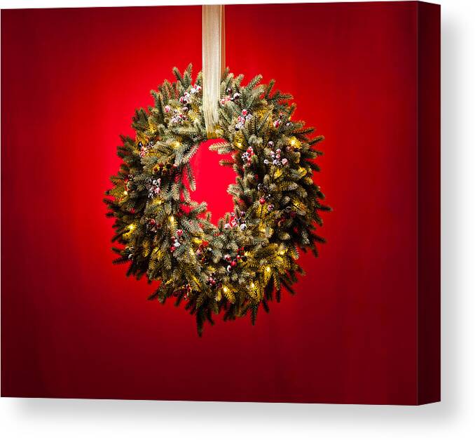 Advent Canvas Print featuring the photograph Advent wreath over red background by U Schade