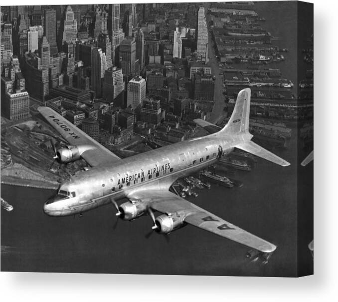 1940's Canvas Print featuring the photograph American DC-6 Flying Over NYC by Underwood Archives