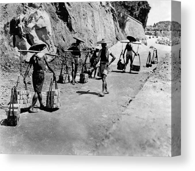 1924 Canvas Print featuring the photograph Coolies Carrying Bricks by Underwood Archives