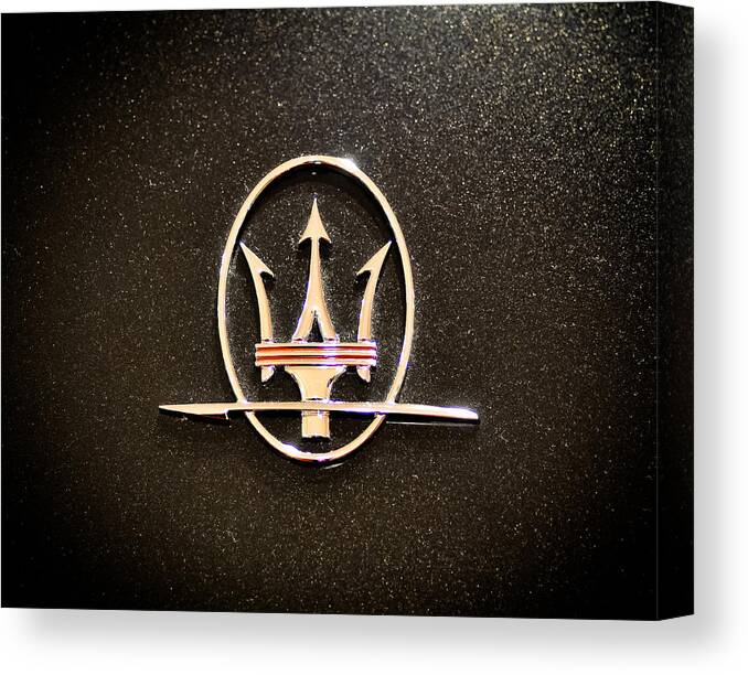 Car Detail Canvas Print featuring the photograph Maserati Logo by Ronda Broatch