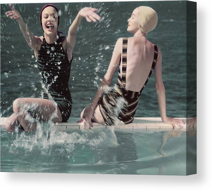 Two People Canvas Print featuring the photograph Models Splashing Water While Sitting On The Edge by Frances McLaughlin-Gill