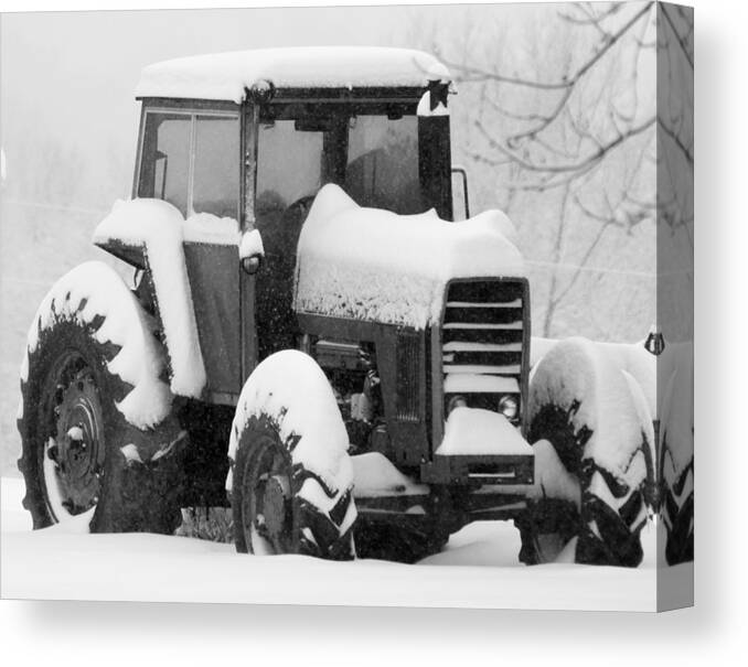 Snow Canvas Print featuring the photograph Old Tractor in the Snow by Holden The Moment