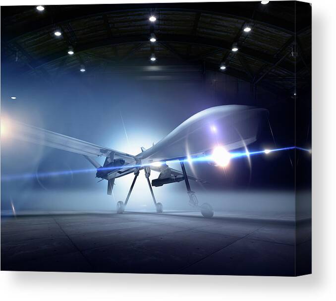 Airplane Canvas Print featuring the photograph Predator Drone At The Ready In A Hangar by Colin Anderson