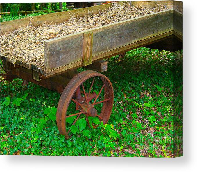 Wagon Canvas Print featuring the photograph Rusted Wagon Wheel by Val Miller