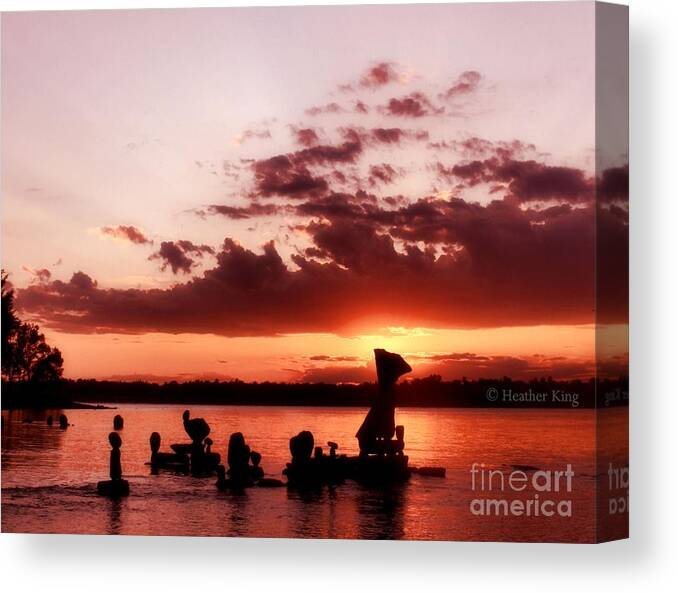 Clouds Canvas Print featuring the photograph Sun going down by Heather King