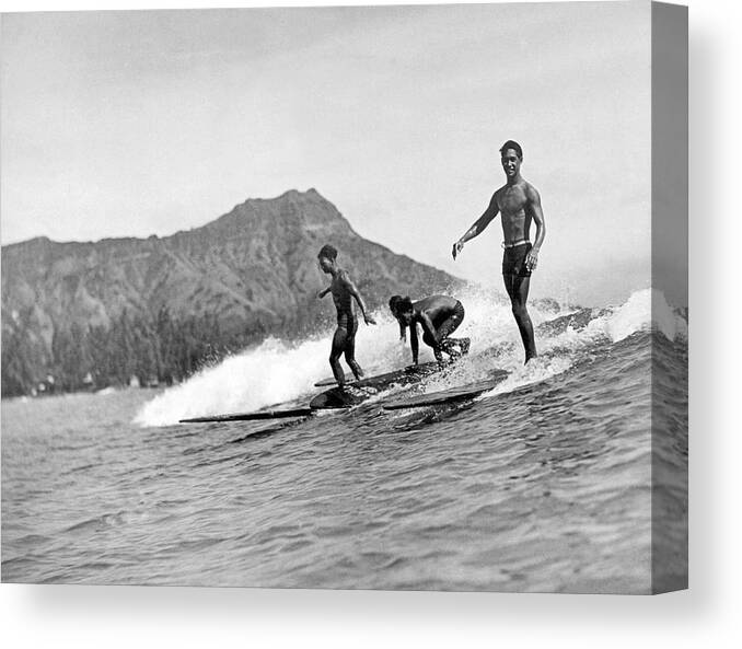 16-20 Years Canvas Print featuring the photograph Surfing In Honolulu by Underwood Archives
