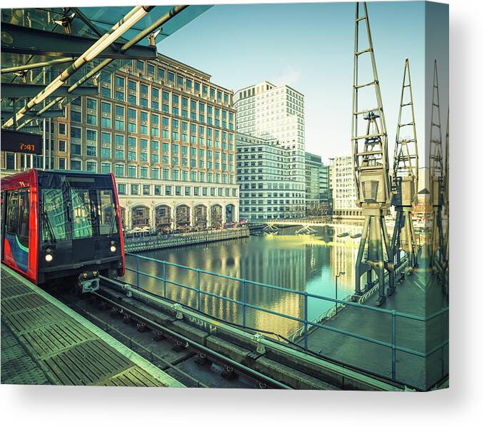 Downtown District Canvas Print featuring the photograph Train In Subway Station At Canary by Cirano83