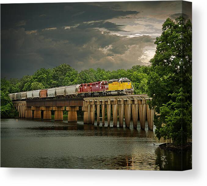Train Canvas Print featuring the photograph Train on a Stormy River Evening by Randy Forrester
