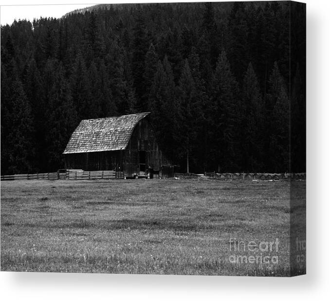 Barns Canvas Print featuring the photograph An Old Barn In Black And White by Jeff Swan