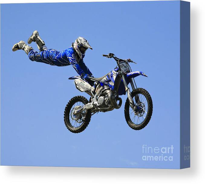 Motorbike Canvas Print featuring the photograph Hanging on by Chris Dutton