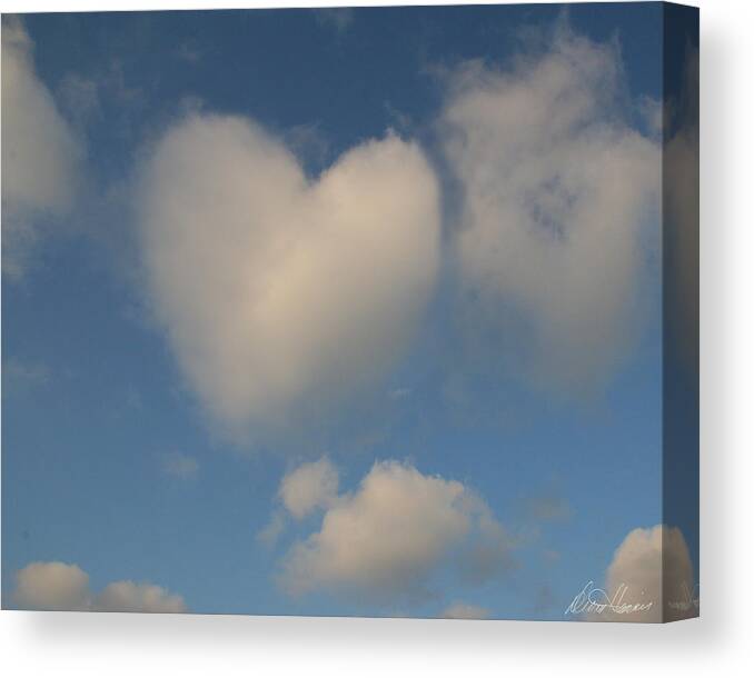 Sky Canvas Print featuring the photograph Heart in the Clouds by Diana Haronis