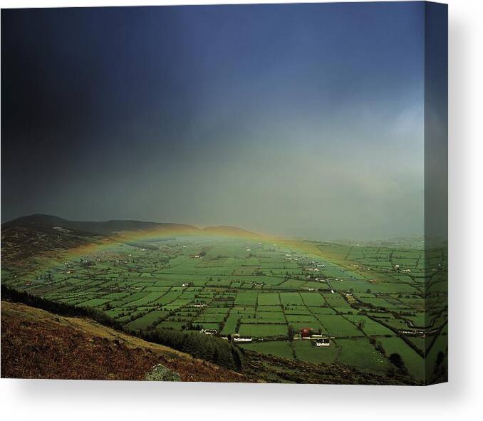 Agricultural Canvas Print featuring the photograph Rainbow Over Fields In Slieve Gullion by The Irish Image Collection 