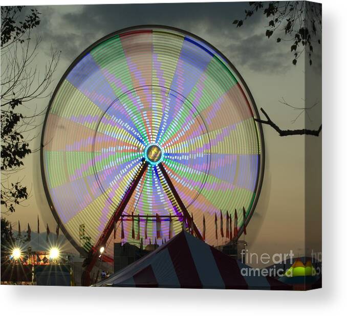 Ferris Wheel Canvas Print featuring the photograph The Pinwheel Glow by Donna Brown
