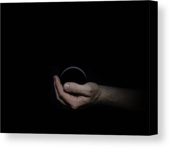 Black Canvas Print featuring the digital art Black Sphere in Hand by Pelo Blanco Photo