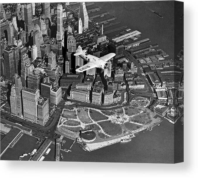 1930's Canvas Print featuring the photograph Hawk's Plane Over Battery Park by Underwood Archives