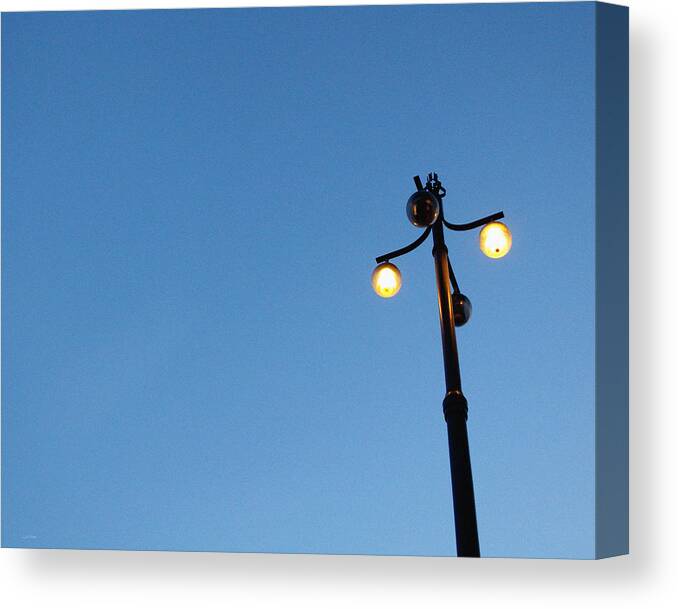 Sky Canvas Print featuring the photograph Stockholm Street Lamp by Linda Woods