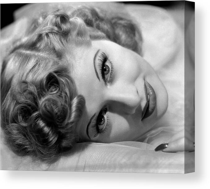 1941 Canvas Print featuring the photograph Lucille Ball Lying On Silk #1 by Ernest Bachrach