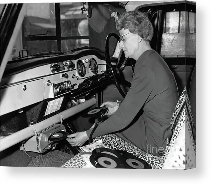 Vintage Canvas Print featuring the photograph 1950s Woman Demonstrating Vehicle Record Player by Retrographs