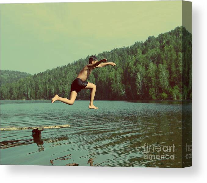 Activity Canvas Print featuring the photograph Boy Jumping In Lake At Summer Vacations by Kokhanchikov