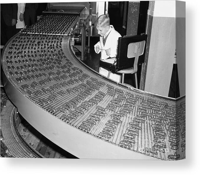 Child Canvas Print featuring the photograph Boy Standing Next To Assembly Line by Bettmann