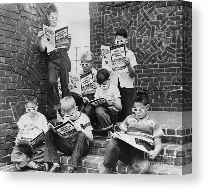 Child Canvas Print featuring the photograph Boys Reading Comic Books by Bettmann