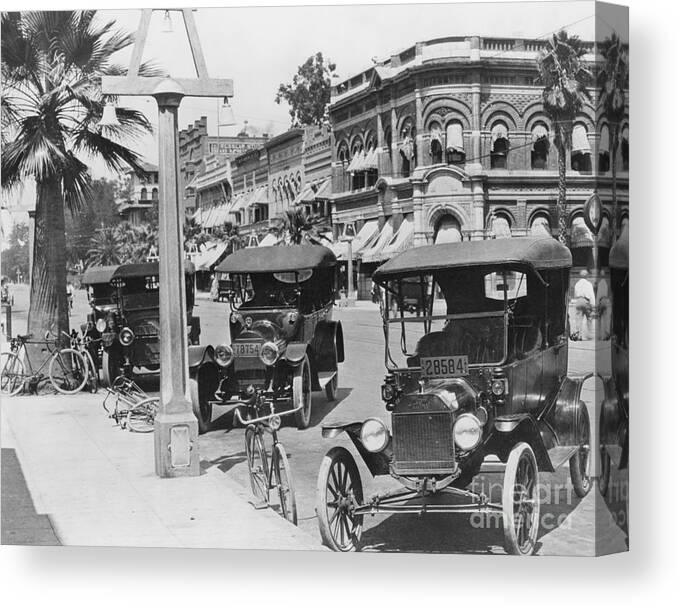 People Canvas Print featuring the photograph Cars Parked Alongside Street by Bettmann