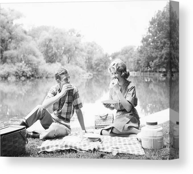 Young Men Canvas Print featuring the photograph Couple Seated On Checkered Tablecloth by H. Armstrong Roberts