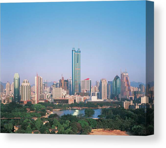 Chinese Culture Canvas Print featuring the photograph Diwang Building On Shenzhen Skyline by Digital Vision.