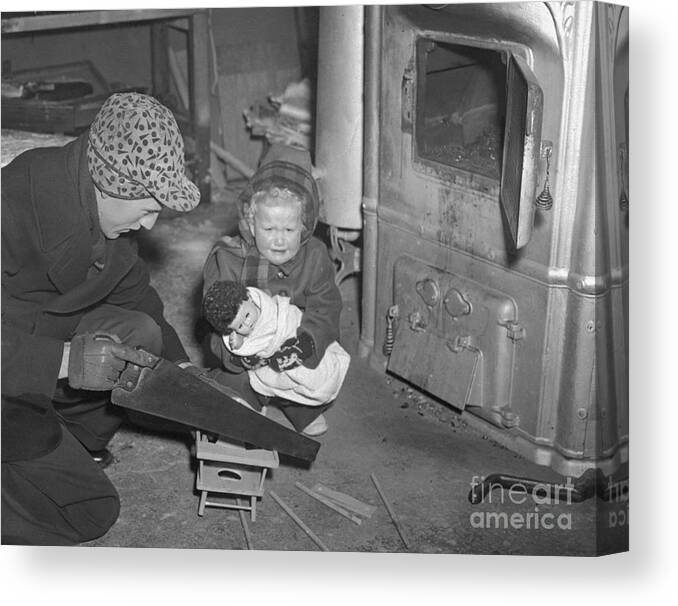Employment And Labor Canvas Print featuring the photograph Father Uses Toy High Chair For Fuel by Bettmann