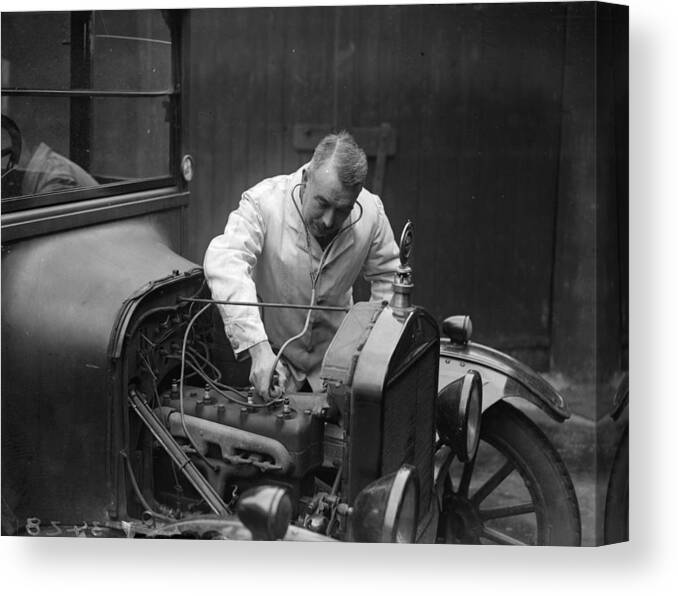 Engine Canvas Print featuring the photograph Garage Doctor by Fox Photos