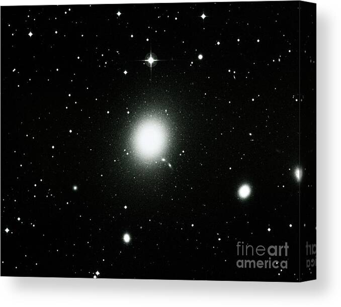 Astronomy Canvas Print featuring the photograph Optical View Of The Elliptical Galaxy M87 by Royal Observatory, Edinburgh/science Photo Library