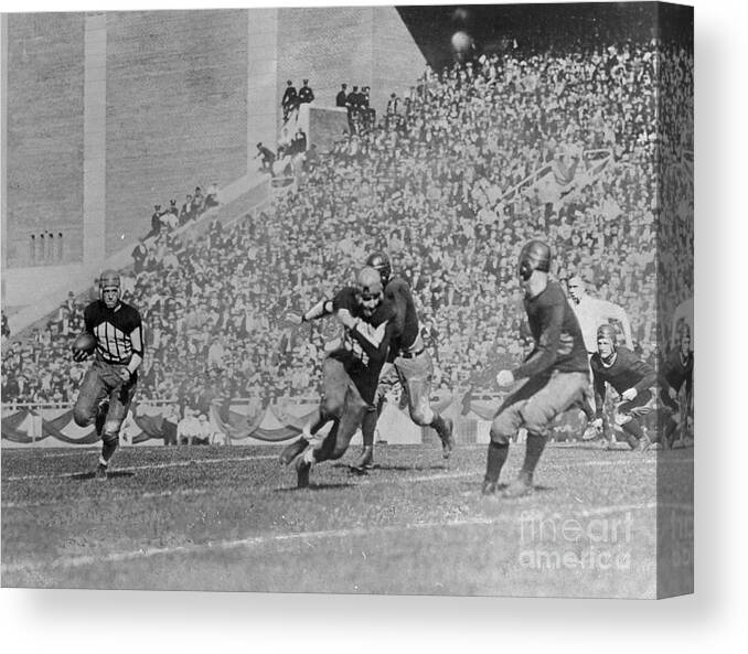 Young Men Canvas Print featuring the photograph Red Grange Running For Goal Line by Bettmann