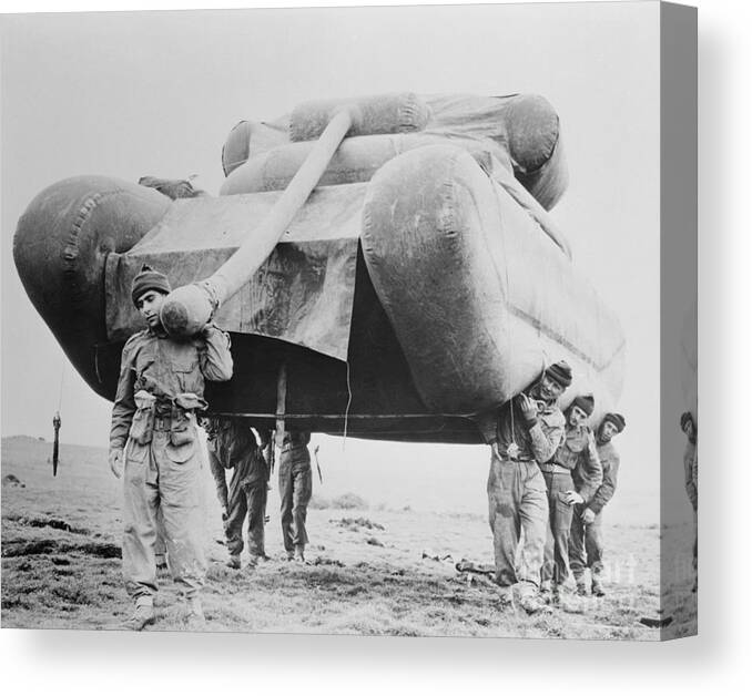 People Canvas Print featuring the photograph Soldiers Carrying An Inflatable Tank by Bettmann