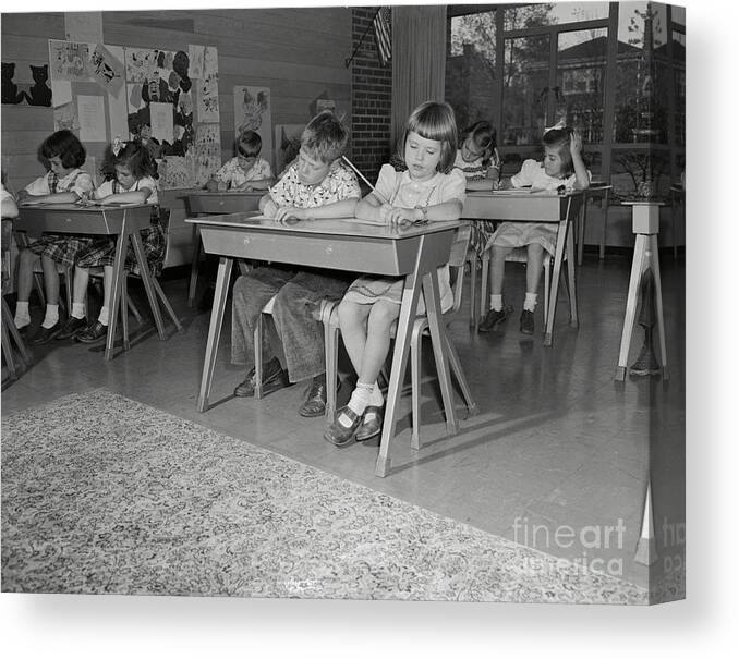 Education Canvas Print featuring the photograph Students Working At Desks In Blythe by Bettmann