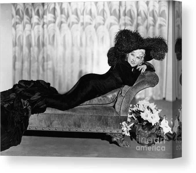 People Canvas Print featuring the photograph Sultry Mae West On Reclining Divan by Bettmann