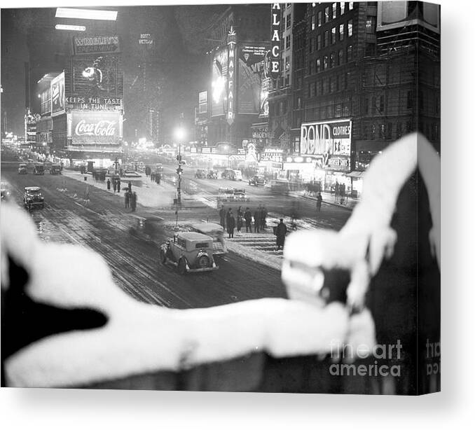 1930-1939 Canvas Print featuring the photograph Times Square During A Snowstorm by New York Daily News Archive