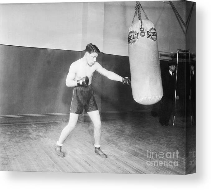 Young Men Canvas Print featuring the photograph Tuffy Griffith Working The Weight Bag by Bettmann