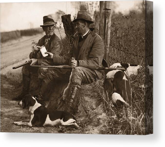 Pets Canvas Print featuring the photograph Two Hunters With Dogs Sharing Cigars by Fpg