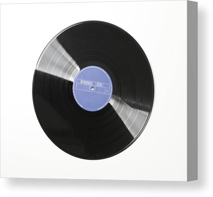 White Background Canvas Print featuring the photograph Vinyl Record On White Background by Vincenzo Lombardo