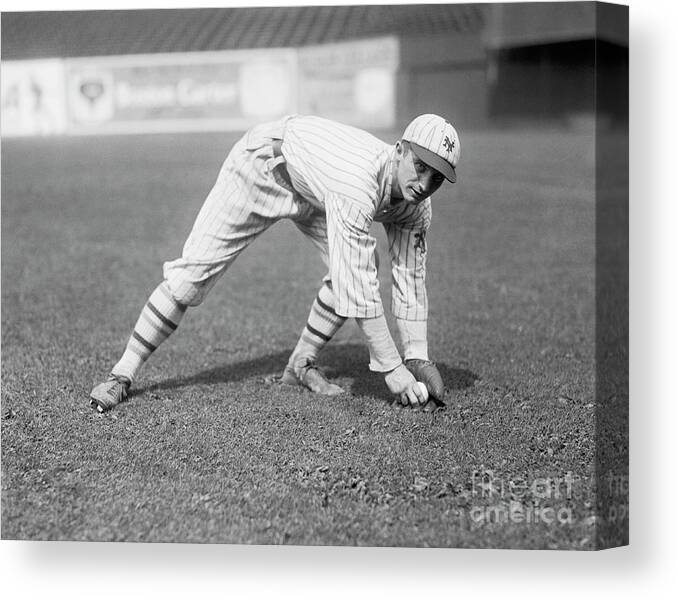 People Canvas Print featuring the photograph Walter Mcphee Going For Ground Ball by Bettmann