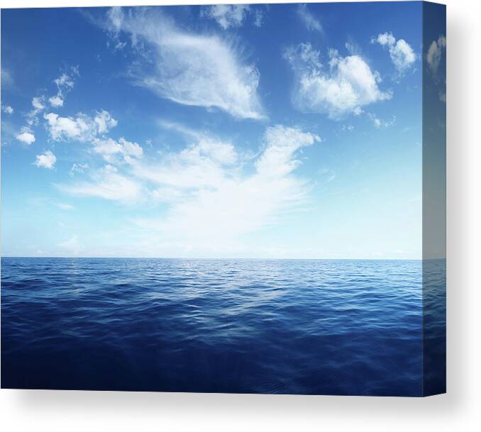 Scenics Canvas Print featuring the photograph Wispy Clouds Over Deep Blue Ocean by Turnervisual
