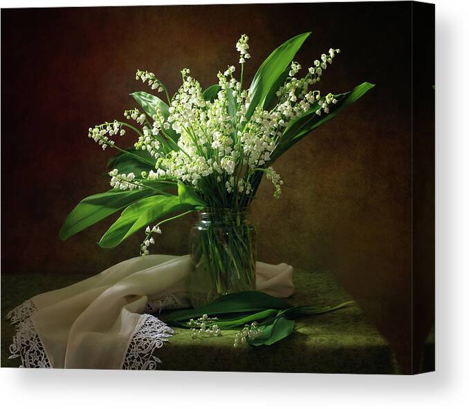 Lily Of The Valley Canvas Print featuring the photograph With A Bouquet Of Lilies Of The Valley by Tatyana Skorokhod (???????