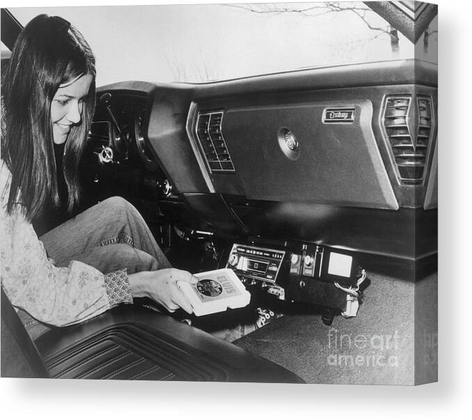 Rock Music Canvas Print featuring the photograph Woman Inserting Eight-track Tape In Car by Bettmann