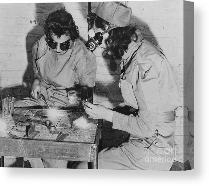 Child Canvas Print featuring the photograph Young Women Working On Machinery by Bettmann