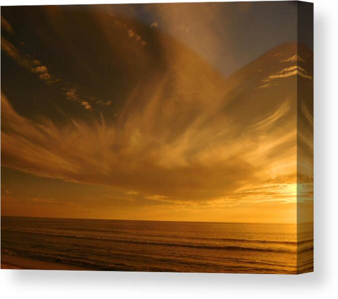 Beach Canvas Print featuring the photograph Angelic Sunset by Karen Stansberry